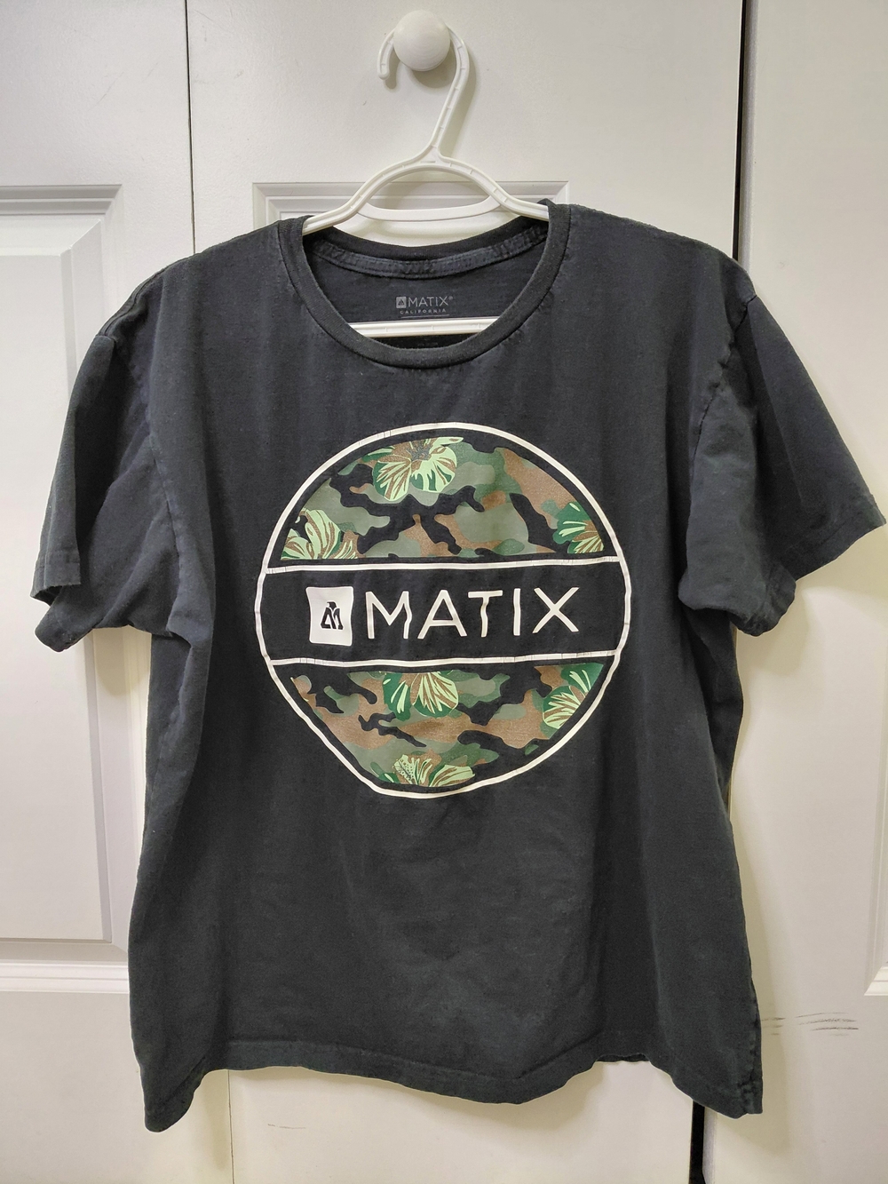 Matix Black Tee with Camouflage Leaf Circle Logo